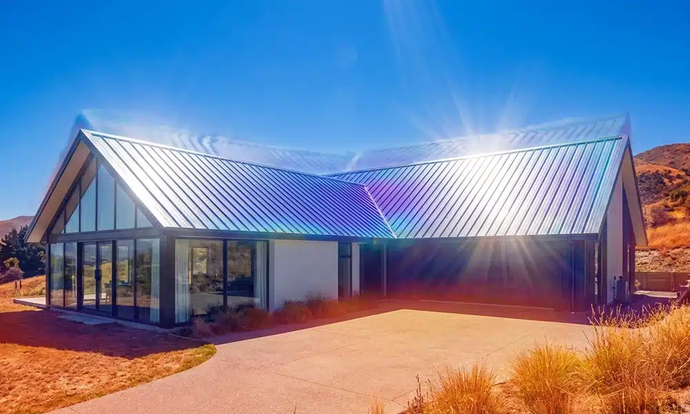 Modern home featuring energy-efficient metal roofing materials designed to reflect sunlight and extend roof lifespan