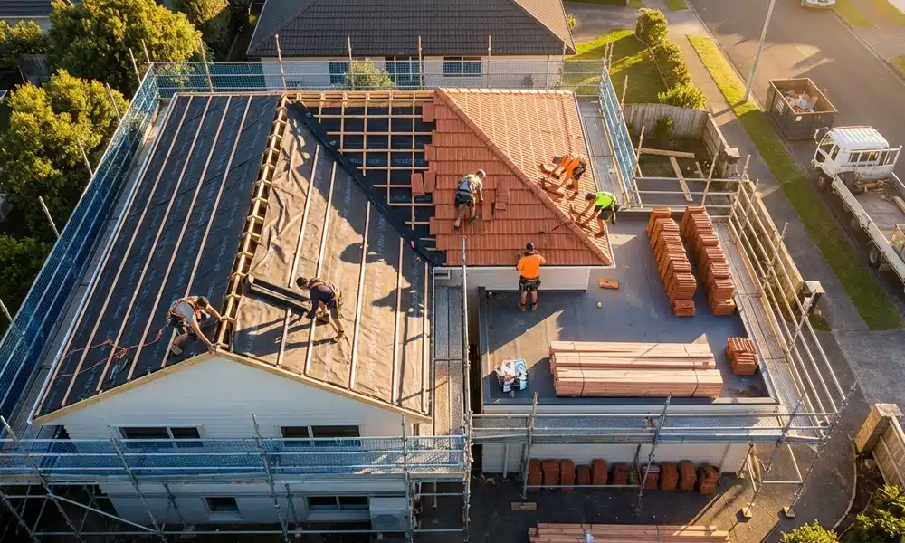 Roof replacement project showing installation work in good weather compared with delays caused by heavy rain and storm conditions